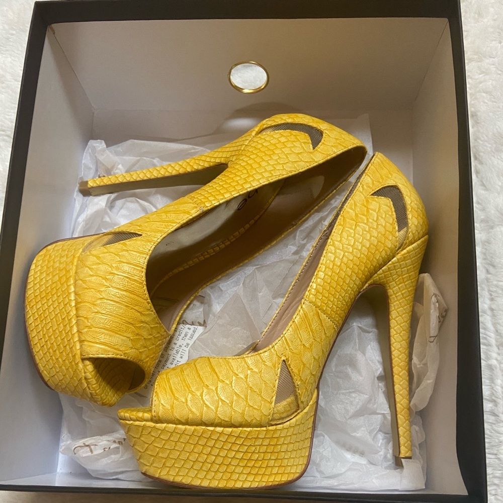 Yellow BEBE Stilletos.